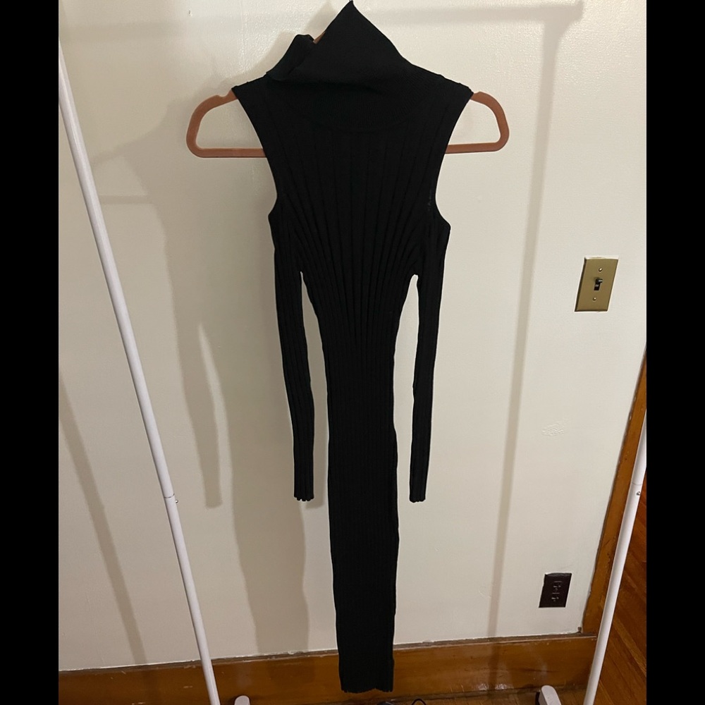 Naked wardrobe size L. Blk dress with cut out shoulders.